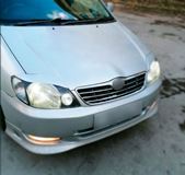 Реснички на фары для Toyota Corolla NZE 121 2000-2005 седан