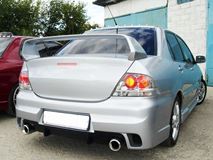 Бампер задний для Mitsubishi Lancer IX в стиле INGS Extreem под двойной выхлоп