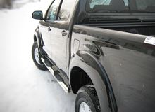 Пороги труба D76 с накладками (вариант 3) для Toyota Hilux 2009-2014