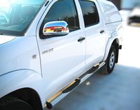 Пороги труба D76 с накладками (вариант 2) для Toyota Hilux 2009-2014