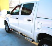 Пороги труба D76 с накладками (вариант 2) для Toyota Hilux 2009-2014