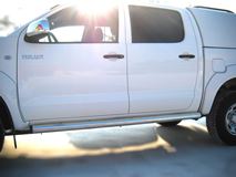 Пороги труба D76 (вариант 2) для Toyota Hilux 2009-2014