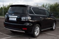 Защита заднего бампера D75х42 овал для Nissan Patrol 2010-2013