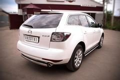Пороги труба D75х42 овал с проступью для Mazda CX-7 2010-2013