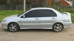 Накладки на внешние пороги Mitsubishi Lancer 9