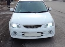 Реснички на фары для Mazda Familia 1998-2000
